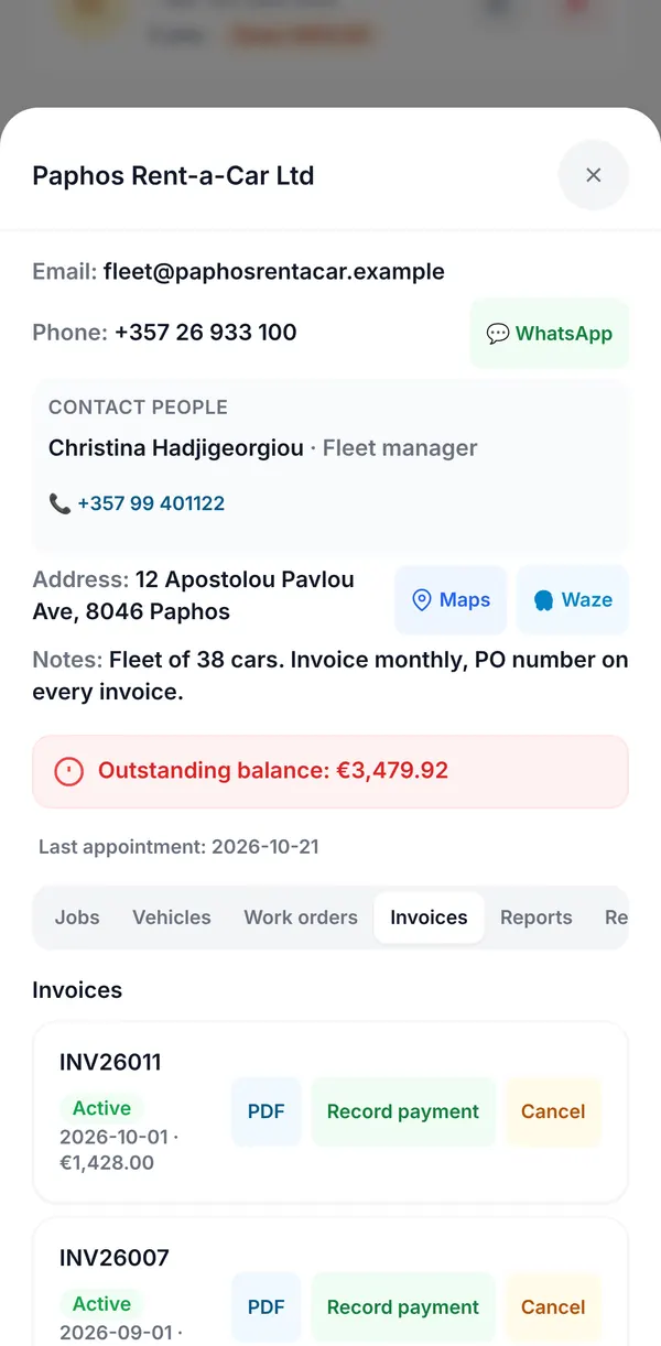 A company client's page with email, phone and WhatsApp, a contact person, Maps and Waze buttons, notes, the outstanding balance and the invoices tab.