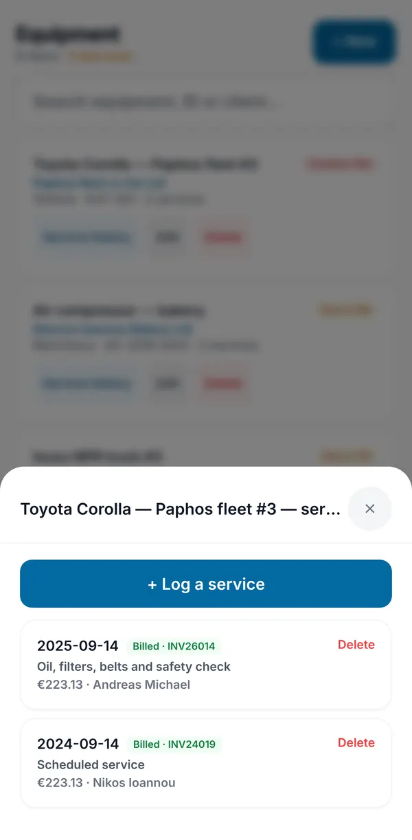 An asset's service history, with each past service marked as billed with its invoice number, and a button to log a new service.